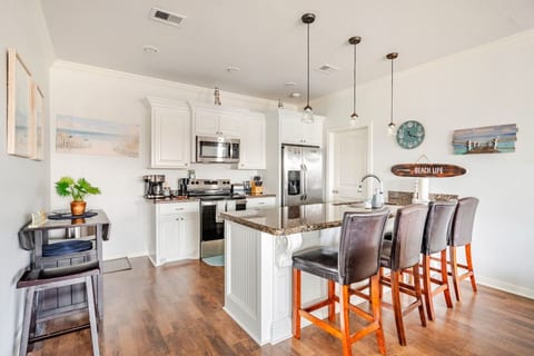 Kitchen with a granite island and bar seating