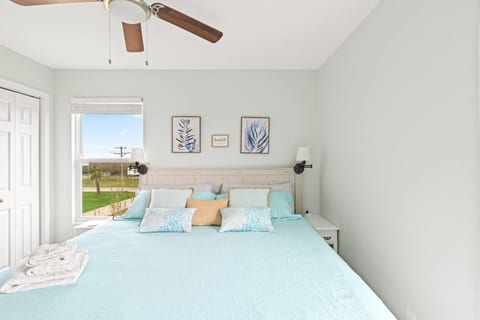 Bedroom with a large bed and views of the coast