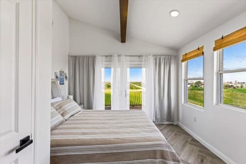 Bedroom with French doors to a private deck