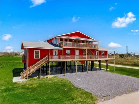Bright red beach triplex with long covered decks