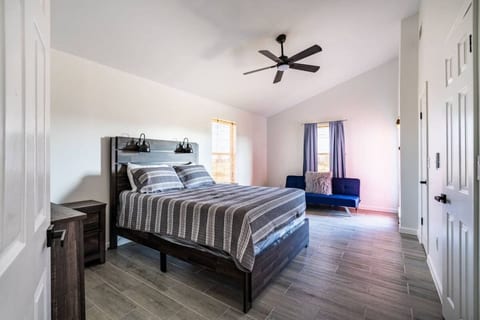 Queen bedroom with a lounge chair