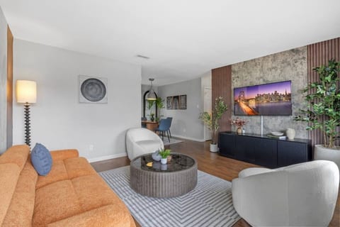 Living room with a smart TV and fireplace wall