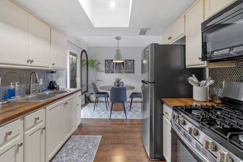 Kitchen with a gas range, open to the dining area