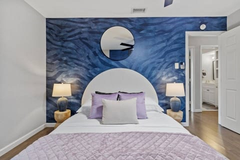 Bedroom with a dramatic blue accent wall