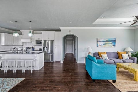 Bright, open living room flowing into the kitchen