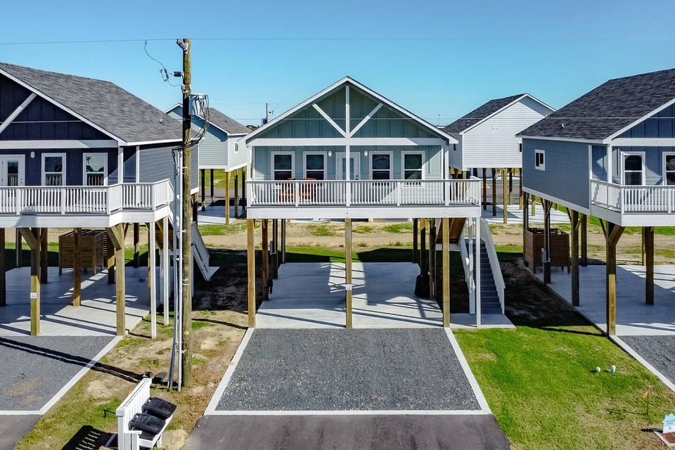 Raised beach cottage with a covered deck