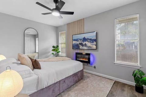 Bedroom with an electric fireplace and smart TV