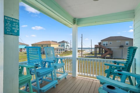 Tall deck chairs facing the beach