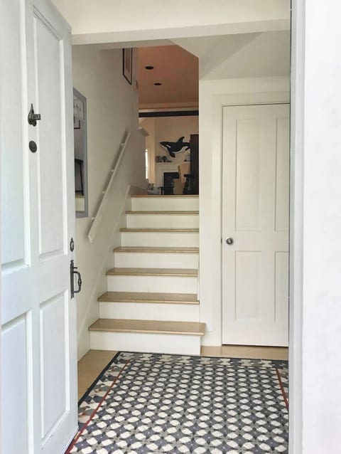 Mid level entrance - up to living room down to 1st floor suite.