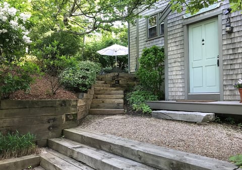 Mid level entrance with stairs to back terrace