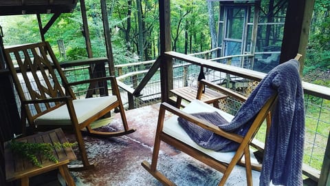 Private seating area outside The Moon room with attached screened in gazebo.