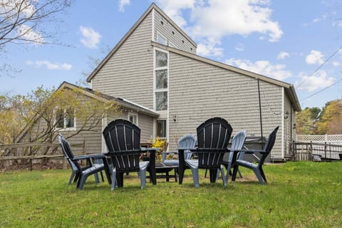 Your family’s gathering spot—cozy Adirondacks, crackling fire, and space for every generation to unwind together.
Our backyard is fenced and has a lot of privacy. It has a large hot tub, outdoor dining area, and firepit.