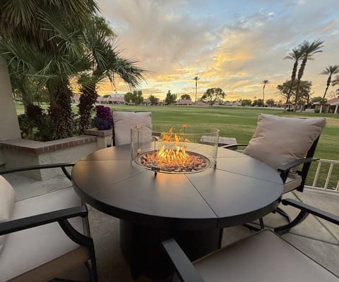 Relax at a comfortable fireside table while you enjoy serene golf course & sunset views.