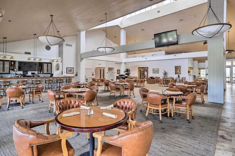 Clubhouse lounge with bar, dining tables, plus outdoor seating with view