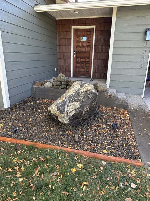 Welcoming front entry with covered porch and landscaped curb appeal