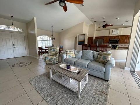 Gather with family and friends in the spacious, sun-filled living area.