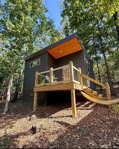 Modern woodland tiny cabin with private deck and relaxing hammock