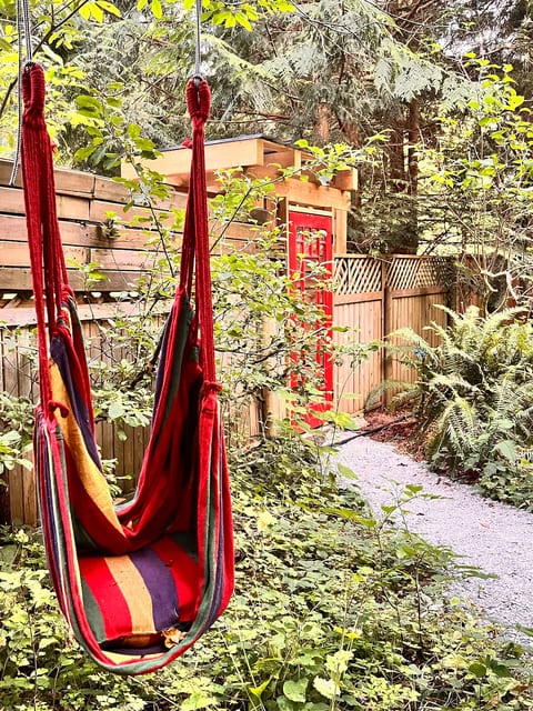 The entrance to the property (red door) as seen from the orchard path.