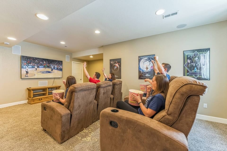 Media Room: Dive into a movie or sports adventure in plush recliners with surround sound and vibrant decor!