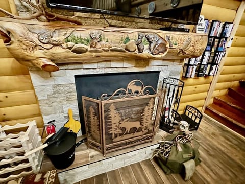 Carved live-edge mantel. Real wood-burning fireplace.
