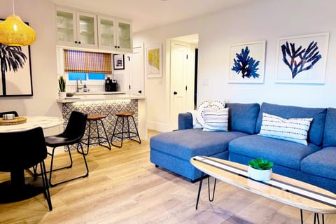 Unwind in our designer living space featuring powerful, quiet A/C and a 85” TV—perfect for cooling off after a day at the beach.