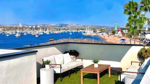 Experience the best views in the neighborhood from your own private rooftop oasis. This space is designed with lounge seating and a large umbrella for shade, it’s the perfect spot to soak in the coastal breeze.