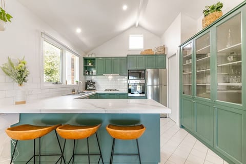 Open plan kitchen with walking pantry and breakfast bar.