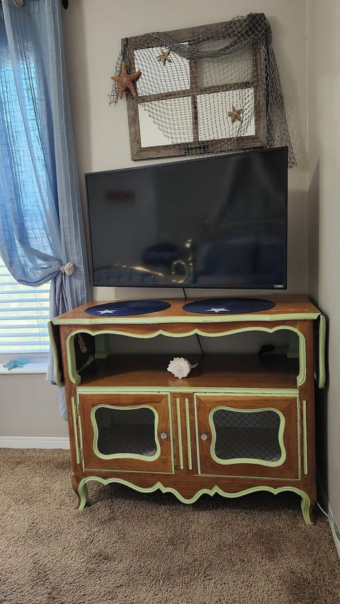 Both, the bedroom and living room have a TV