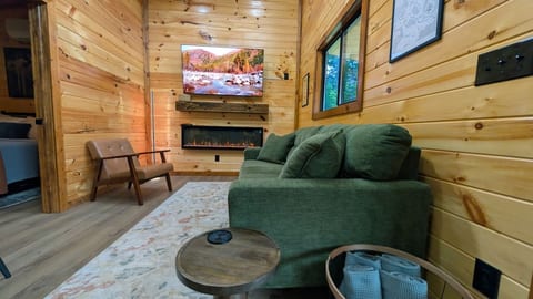 Cozy up on the sofa by the electric fireplace and enjoy your favorite shows on the 65-inch Roku TV. Spa towels are ready for the hot tub.