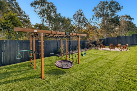 Outdoor Area : The backyard offers something for everyone, with a large lawn, fire pit seating, outdoor entertaining space and kids’ play area.