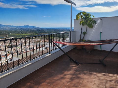 Panoramic roof terrace with hammock, outdoor shower, and sea and mountain views