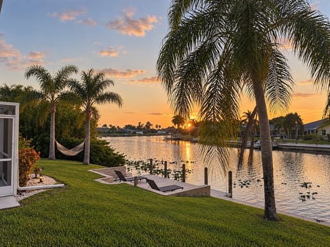 Spacious Waterfront Pool Home | Stunning Sunsets image 3
