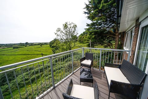 Main balcony comes with sliding doors and outdoor furniture