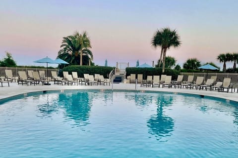 Take in the cotton candy sky while cooling off in the saltwater pool.