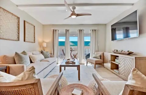 Living room with queen size pull out sofa bed. Smart TV (bring your own streaming passwords) and cable provided. Sliding glass doors lead out to the balcony. Games, books and bedding are located in the console.