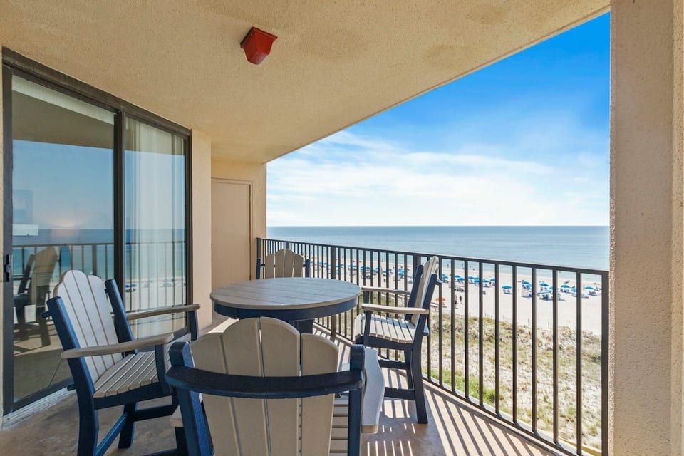 The Gulf straight out front, off the living and dining rooms. The balcony wraps around the corner to a second, north-facing section.
