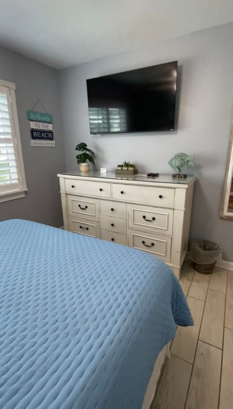 Primary Bedroom with 50 inch smart tv