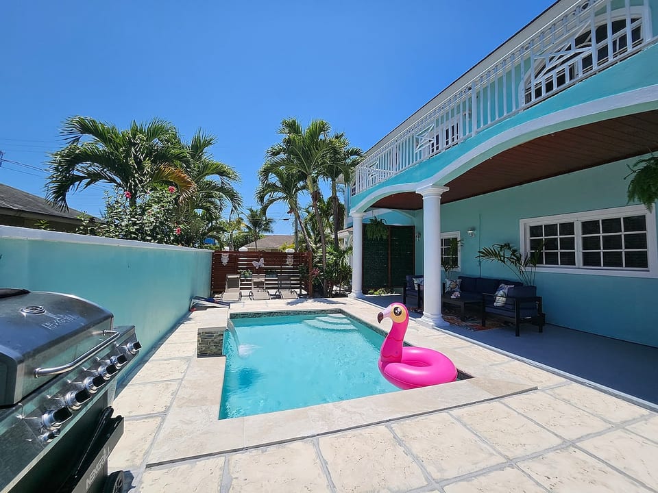 Shared Pool in Backyard along with Propane BBQ Grill Patio Set and Loungers