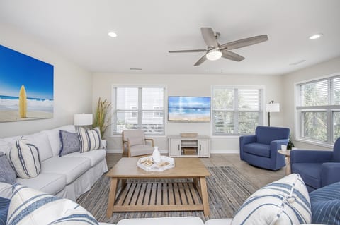 Enjoy a spacious living room designed for togetherness, where the whole family can gather comfortably.
