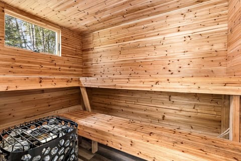 Relax and recharge in our large outdoor sauna with changing room. With a window offering stunning views of the surrounding nature and lake, this sauna provides the perfect balance of warmth and tranquility.
