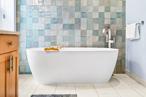 Experience serene relaxation in a spa-inspired soaking tub designed for ultimate comfort and calm
