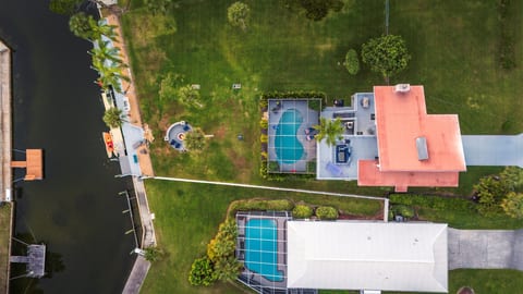 Waterfront escape with pool, fire pit,  and private 45-ft dock.