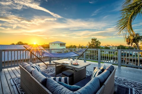 Sunset views from Hernando Hideaway’s private upper deck — the perfect spot to unwind with a drink and enjoy the coastal breeze.