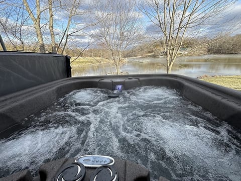 Enjoy the year round hot tub while taking in the serenity of the lake.