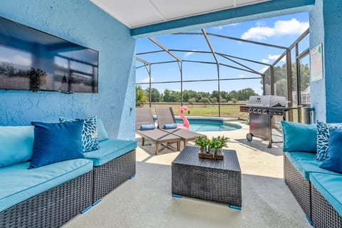 Covered outdoor seating beside the private pool