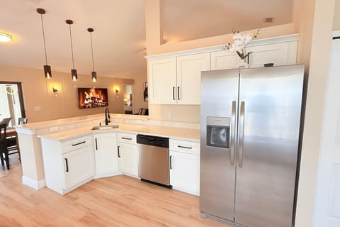Full kitchen with refrigerator/freezer and dishwasher