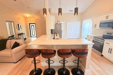 Kitchen island with four bar stools