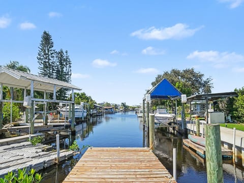 Step onto your private dock and enjoy peaceful canal views at White Heron Landing, your waterfront retreat in Ruskin, Florida.