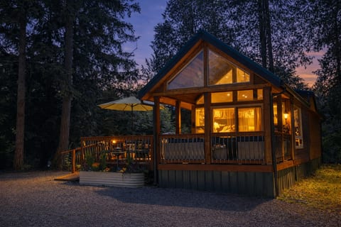 Magic Lantern glowing at twilight on 2+ private acres of cedar forest