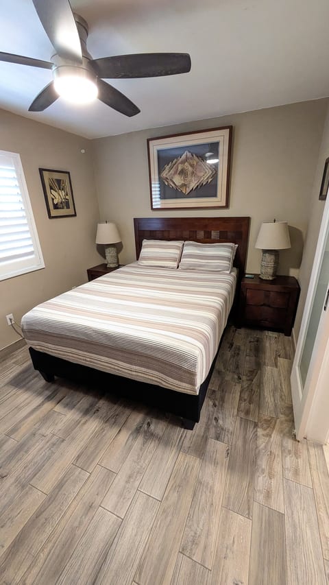 Queen size bed with a comfortable mattress for great sleep during your stay. Overhead ceiling fan provides a nice breeze to keep you cool at night.